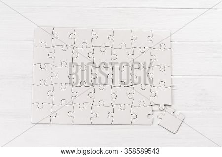 Rectangular jigsaw puzzle on white table