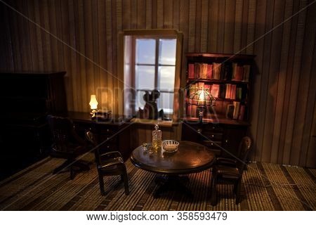 A Realistic Dollhouse Living Room With Furniture And Window At Night. Artwork Table Decoration With