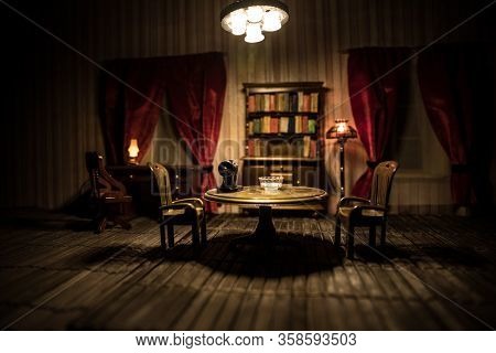 A Realistic Dollhouse Living Room With Furniture And Window At Night. Artwork Table Decoration With