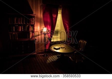 A Realistic Dollhouse Living Room With Furniture And Window At Night. Artwork Table Decoration With