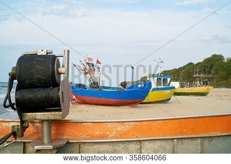 Rewal, Poland - September 01, 2019: Fishing Boats On The Beach Of The Polish Baltic Sea Coast Near R