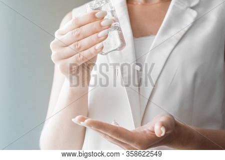 Women Washing Hands With Antibacterial Sanitizer Gel. Hygiene Concept. Prevent The Spread Of Germs A