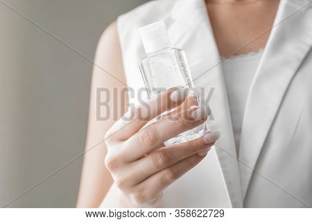 Women Washing Hands With Antibacterial Sanitizer Gel. Hygiene Concept. Prevent The Spread Of Germs A