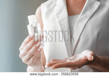Women Washing Hands With Antibacterial Sanitizer Gel. Hygiene Concept. Prevent The Spread Of Germs A