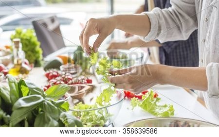 Cooking Concept, Coolinary, Healthy Lifestyle. Unrecognizable Woman Making Fresh Salad Full Of Vitam