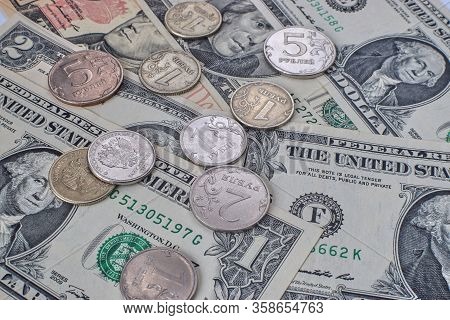 Coin Ruble On The Background Bills Dollar.