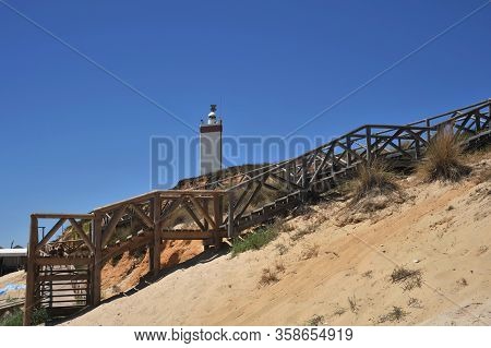 Matalascanas, Spain - July 10, 2011:lighthouse On The Atlantic Ocean In Matalascanas