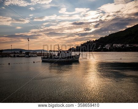 Sunset Over The Mediterranean Sea In Drvenik Harbor With Boats, Croatia