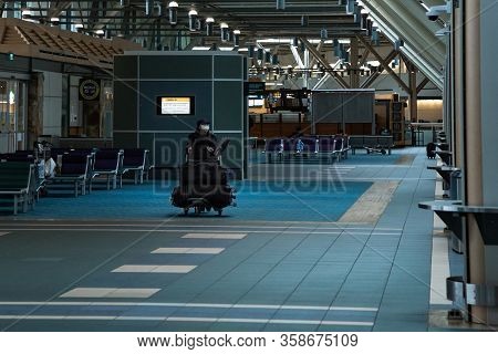 Richmond, Bc, Canada - Mar 29, 2020: Travellers In The International Departures Section Of Yvr Which