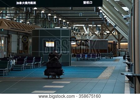 Richmond, Bc, Canada - Mar 29, 2020: Travellers In The International Departures Section Of Yvr Which