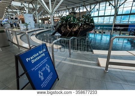 Richmond, Bc, Canada - Mar 29, 2020: International Departures Section Of Yvr Which Is Nearly Empty D