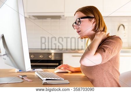 Woman Freelancer In Beige Top Suffers From Pain In Her Neck After Long Work At Computer During The P