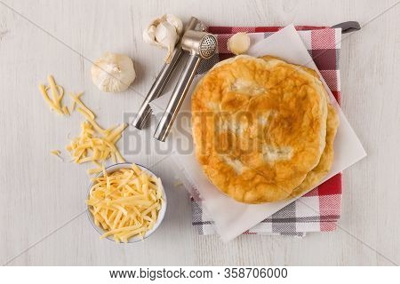 Delicious Langos With Grated Cheese And Garlic, Top View. Culinary Eating.
