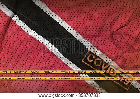 Trinidad And Tobago Flag And Orange Covid-19 Stamp With Border Tape. Coronavirus Or 2019-ncov Virus 