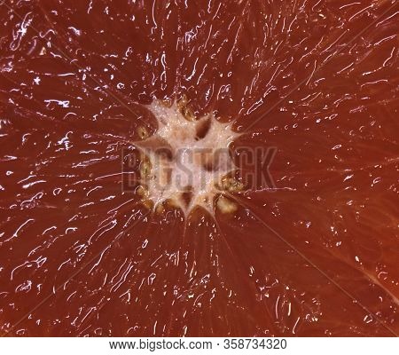 Texture Of Grapefruit Slice, Close-up, Citrus Backgrounds. Macro Of Red Grapefruit. Fresh Grapefruit