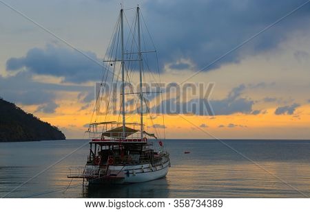 Morning landscape with a yacht at sea. Take it in Adrasan village in Turkey. Mediterranean Sea in Turkey.
