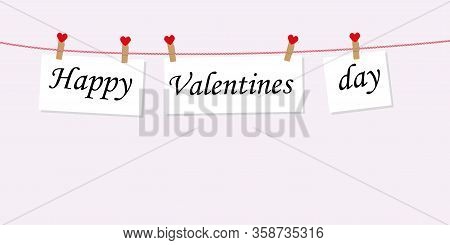 Happy Valentine's Day Concept With Text On Paper Hanging On A Rope Attached With A Clothespin. To Th