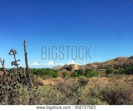 Scenic Cerrillos Hills, Cactus And Rustic Wooden Post Form Views From Town Of Cerrillos, New Mexico.