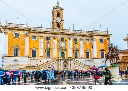 Rome, Italy - November 04 2018: Tourists Line In Front Palazzo Senatorio By Equestrian Monument Of M