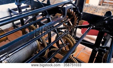 Old Machine With Gears. Stock Footage. Open Mechanism With Gear Of Old Tower Clock. One Pinion Rotat