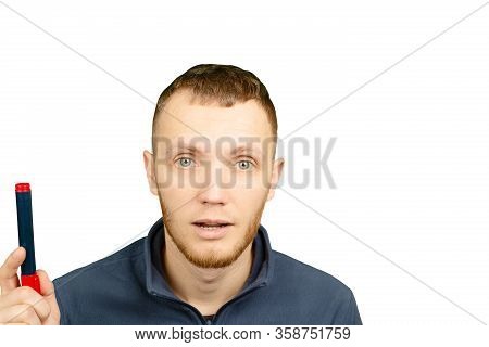 Man With Marker In His Hands Is Thoughtfully Looking Up On White Isolated Background.