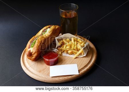 Hot Dogs With French Fries And Ketchup On Wooden Plate.