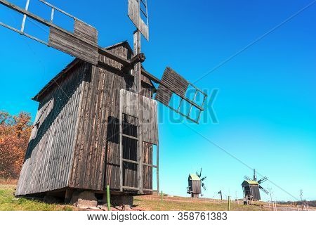 Old Wooden Windmills In Sunny Meadow. Autumn Rural Landscape, Pyrohiv, Kyiv, Oct.2019