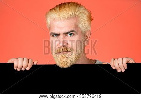 Young Man Holding Black Blank Sheet. Copyspace. Man Office Worker Holding Advertising Board. Adverti