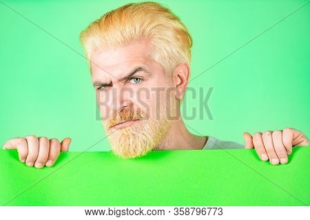 Serious Man Holding Empty Blank Paper Board With Copy Space For Text. Happy Man Holding Empty Green 
