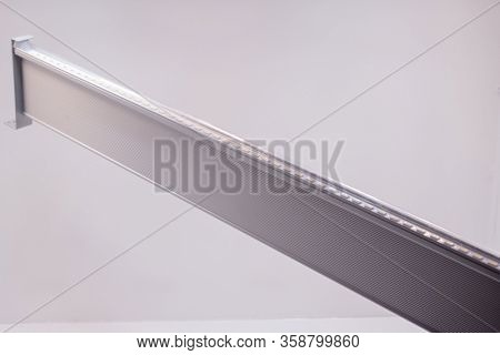 Close-up of metal plank with LEDs used for plant illumination in greenhouse, isolated background