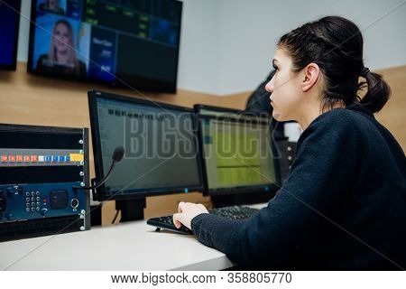 Female Tv Director Control Editing Room In Television Studio.operating Vision Mixer Console Equipmen