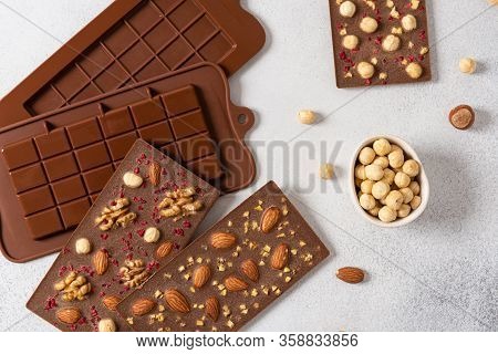 Homemade Milk Chocolate Bars With Nuts And Dried Fruits In Molds. Chocolatier, Confectionery. Top Vi