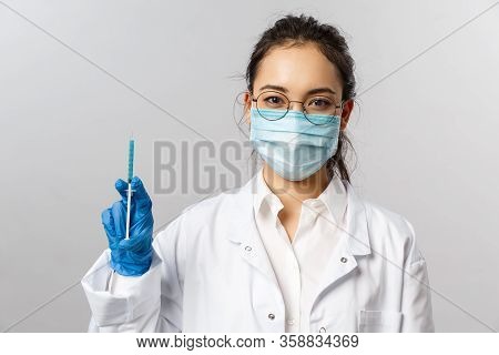 Doctors, Infectionist, Research And Covid19 Concept. Portrait Of Serious Asian Young Female Nurse In