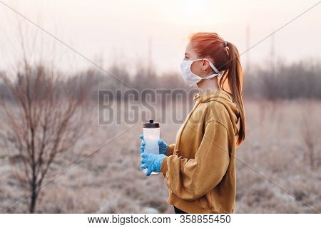 Covid-19 Pandemic Coronavirus Girl In Mask And Blue Gloves During Quarantine