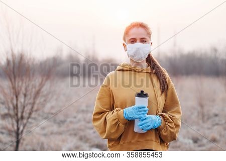 Covid-19 Pandemic Coronavirus Girl In Mask And Blue Gloves During Quarantine