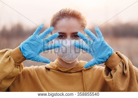 Covid-19 Pandemic Coronavirus Girl In Mask And Blue Gloves During Quarantine
