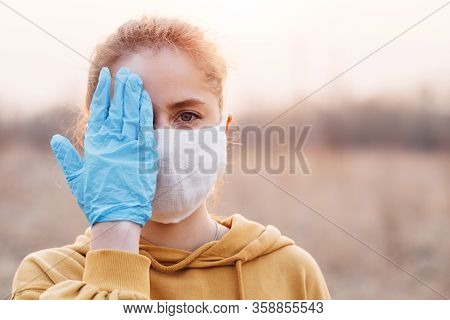 Covid-19 Pandemic Coronavirus Girl In Mask And Blue Gloves During Quarantine