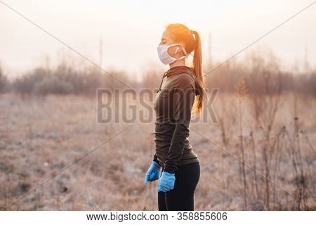 Covid-19 Pandemic Coronavirus Girl In Mask And Blue Gloves During Quarantine Went Out To Run