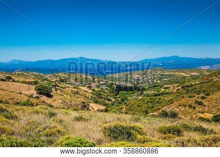Panoramic view from above on the forests of Evia island  with the sea on the horizon on a sunny day. Evia . Greece. 