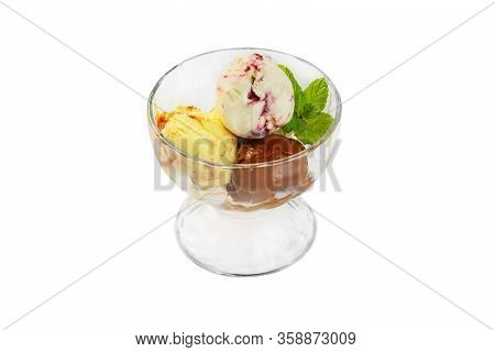 Colored Balls Of Ice Cream In A Glass Cremant On An Isolated Background.