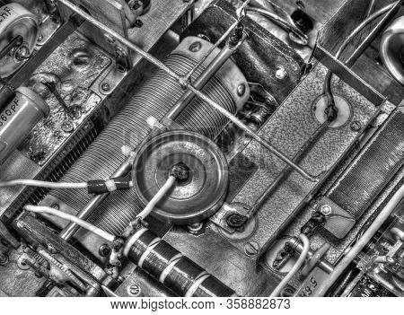 Inside View Of High Frequency Power Amplifier With Capacitors, Coils And Other Components In Black A