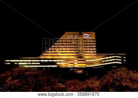 Night Time View Of Unisa Main Building With Lights On
