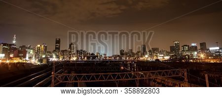Night Time View Of Commuter Trains Under Nelson Mandela Bridge In Braamfontein Johannesburg Cbd