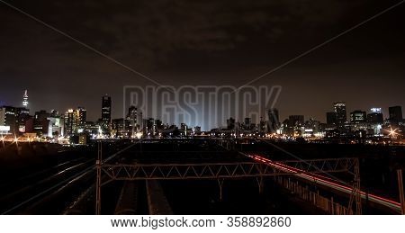 Night Time View Of Commuter Trains Under Nelson Mandela Bridge In Braamfontein Johannesburg Cbd