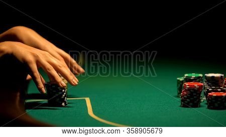 Female Hands Taking Casino Chips, Strategy And Betting All-in, Bluffing, Closeup