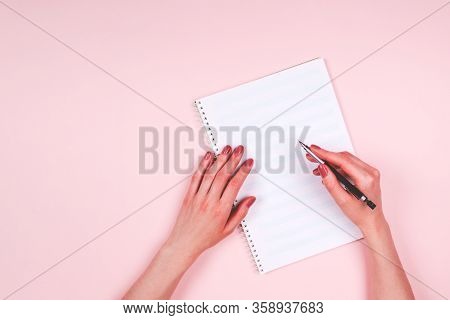 Woman Hands With Music Book On Light Pink Background