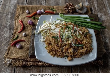 Asian Eating Food, Mee Grob Is An Sweet And Sour Crispy Noodles, Made From Thai Rice Noodle With Swe