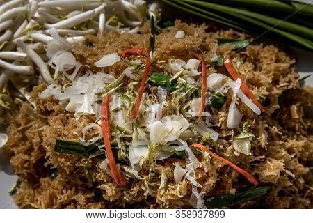 Asian Eating Food, Close-up Of Mee Grob Is An Sweet And Sour Crispy Noodles, Made From Thai Rice Noo