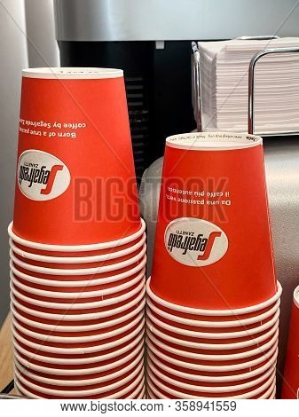 Segafredo Disposable Coffee Cups Piles In Cafe. Street Food And Drinks Take Away Waste Problem Conce