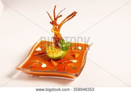 Seasoned Tomato Soup With Avocado And Decorations